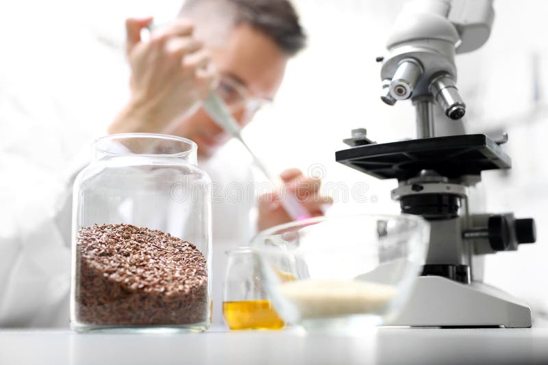 Technician inspecting food samples in a quality lab